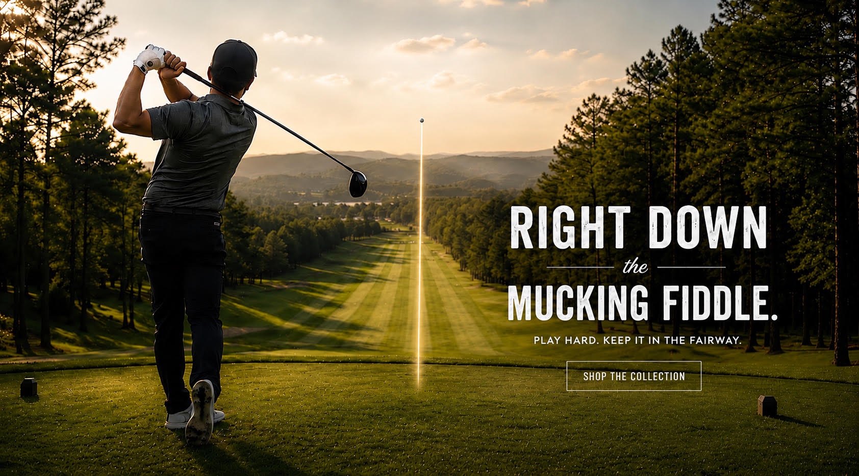 Golfer driving one down the fairway at sunset — Right Down the Mucking Fiddle. Play hard. Keep it in the fairway. Shop the collection.